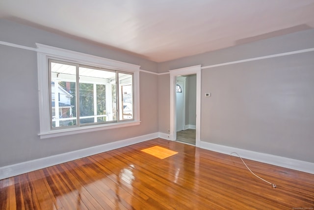 unfurnished room featuring hardwood / wood-style floors