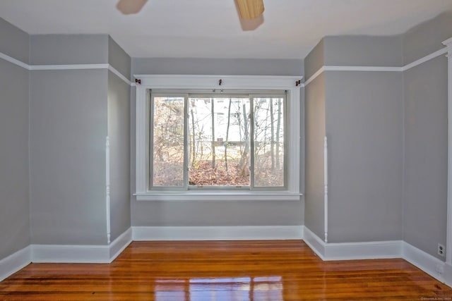 spare room featuring ceiling fan and hardwood / wood-style floors