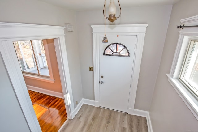 foyer with light wood-type flooring