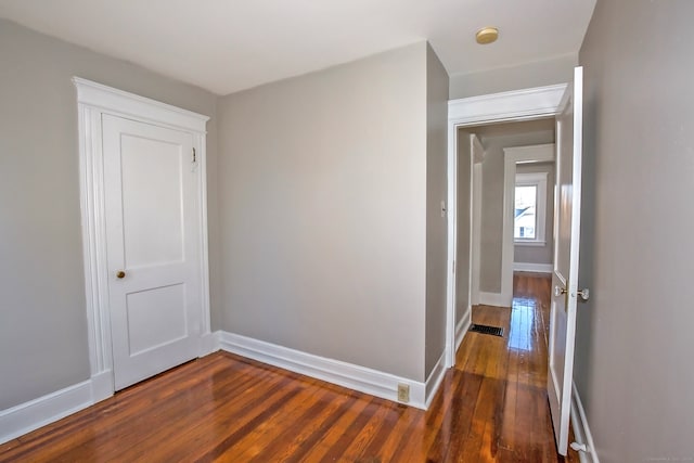 hallway featuring dark hardwood / wood-style floors