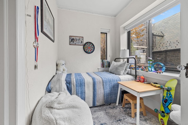 carpeted bedroom featuring crown molding