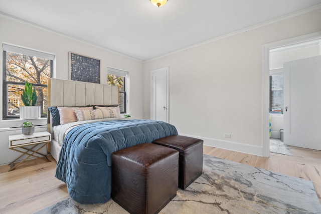 bedroom with light hardwood / wood-style flooring and ornamental molding