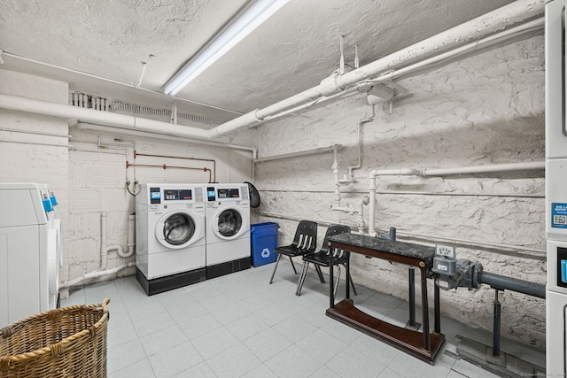 laundry room with separate washer and dryer