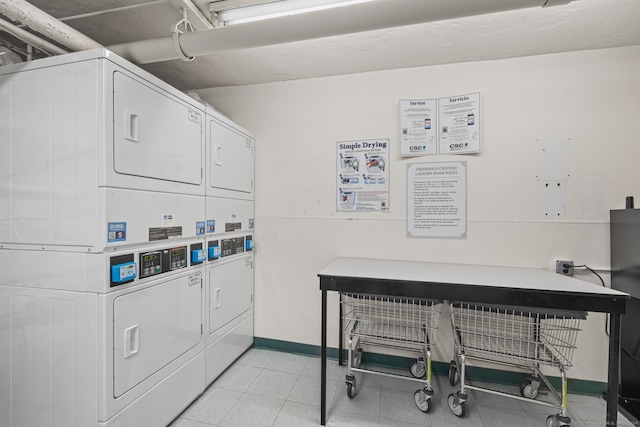 washroom with stacked washer and clothes dryer