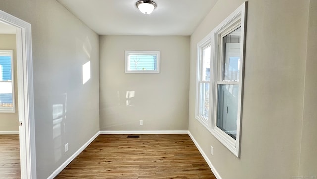 unfurnished room featuring wood-type flooring