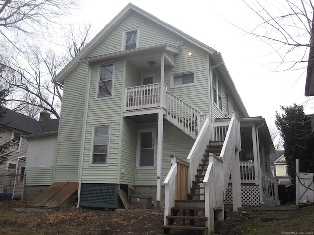 back of property with a balcony