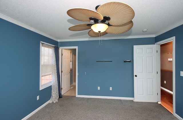 unfurnished bedroom with a textured ceiling, ceiling fan, and ornamental molding