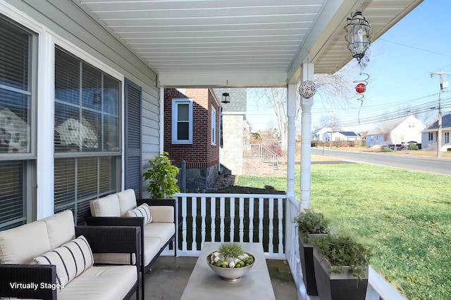 view of patio featuring a porch