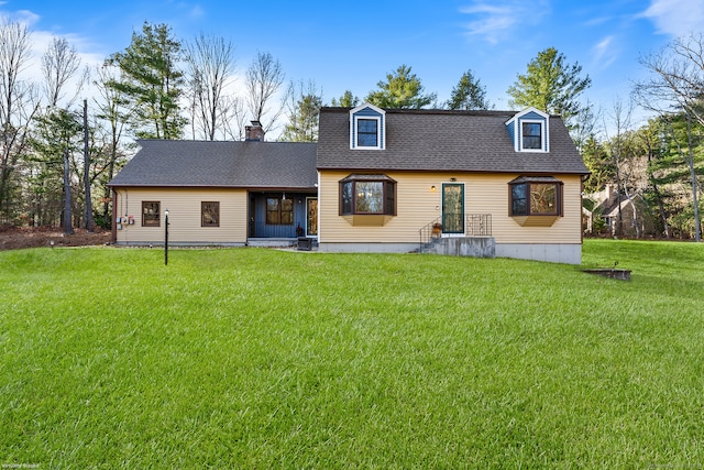 back of house featuring a lawn