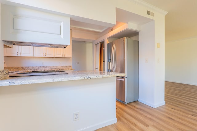 kitchen featuring light wood-style floors, stainless steel fridge with ice dispenser, crown molding, baseboards, and light stone countertops