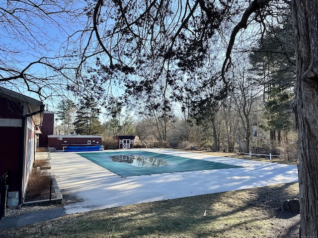 community pool featuring an outbuilding