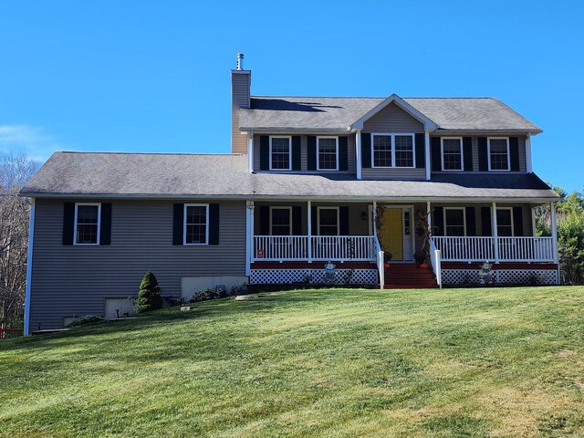 view of front of home with a front yard and a porch