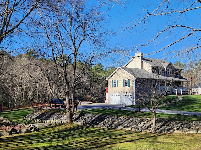 view of property exterior featuring a garage and a yard