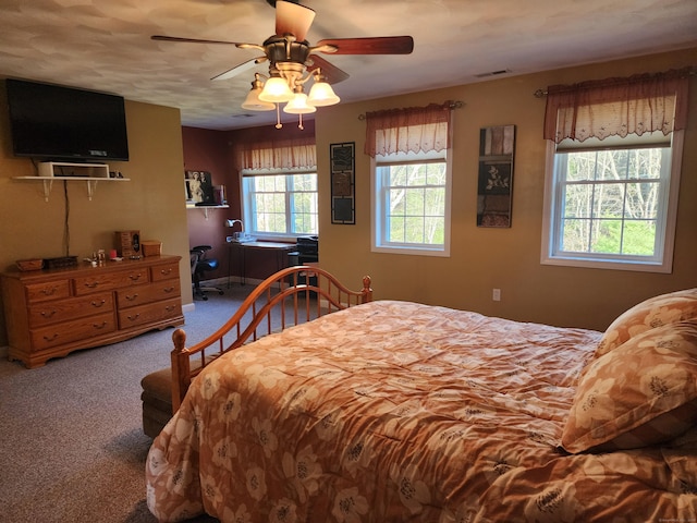 bedroom with ceiling fan and carpet flooring