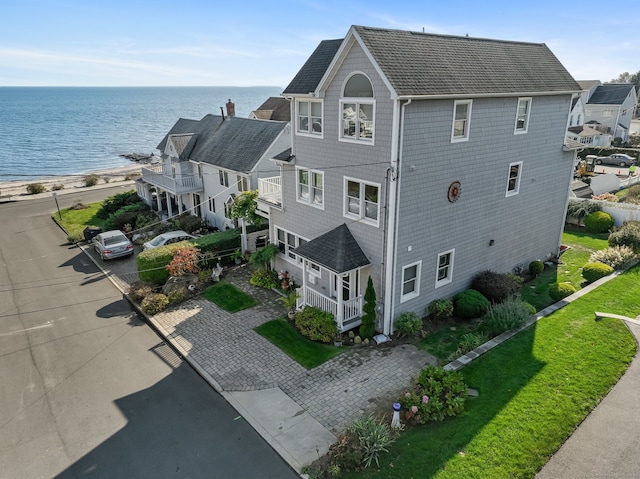 birds eye view of property featuring a water view