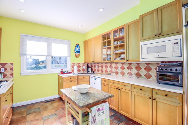 1 Dunbar Rd, Milford, CT 06460 - kitchen featuring white appliances, backsplash, baseboards, glass insert cabinets, and recessed lighting