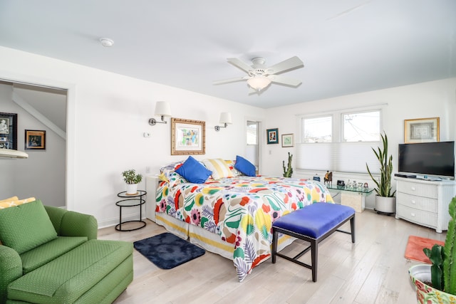 bedroom with ceiling fan and light wood-type flooring