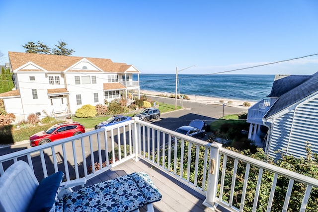 balcony with a beach view and a water view