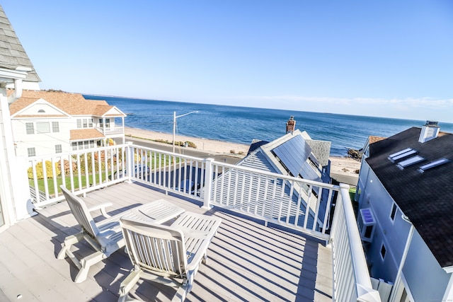 wooden deck featuring a water view