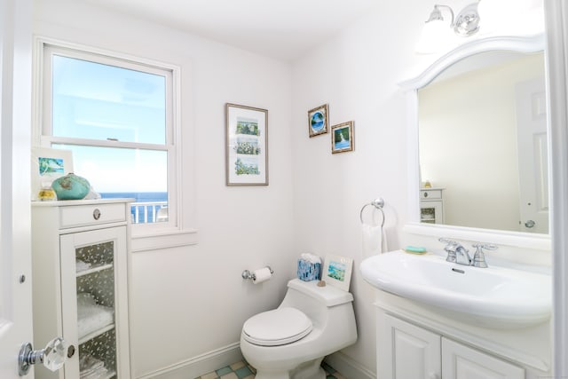 bathroom featuring vanity and toilet