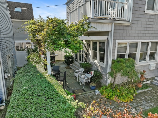 exterior space with a patio and a balcony