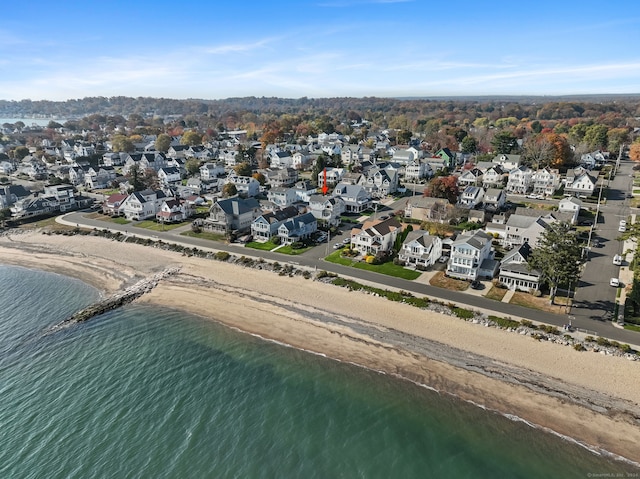 drone / aerial view featuring a view of the beach and a water view