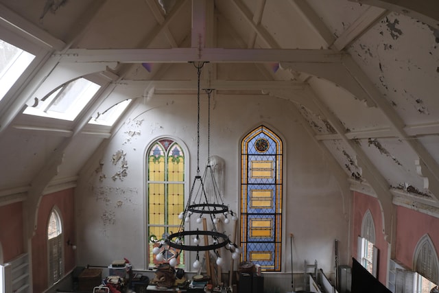 bonus room featuring vaulted ceiling with skylight