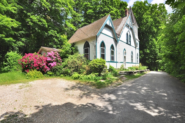 14 River Rd, Cornwall, CT 06796 - view of front of home with a chimney, driveway, and roof with shingles