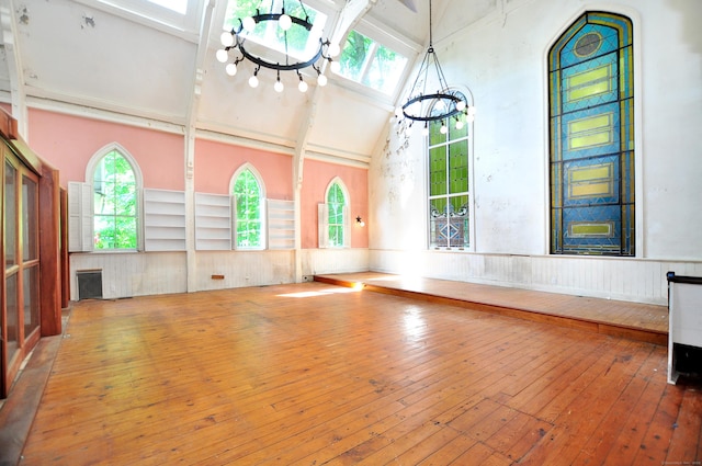14 River Rd, Cornwall, CT 06796 - empty room with a chandelier, hardwood / wood-style floors, high vaulted ceiling, healthy amount of natural light, and beamed ceiling