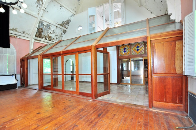 14 River Rd, Cornwall, CT 06796 - unfurnished living room featuring a high ceiling, wood-type flooring, and french doors