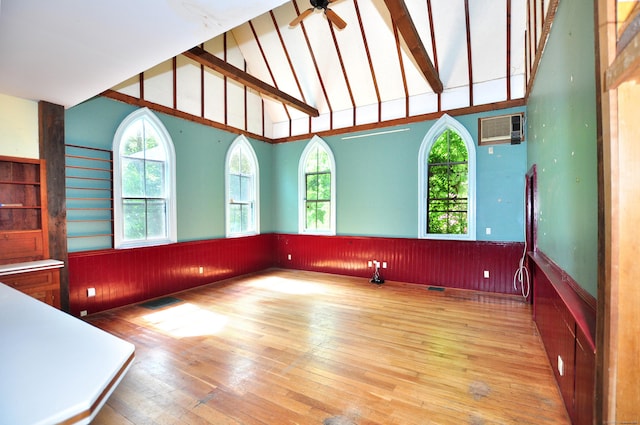 14 River Rd, Cornwall, CT 06796 - empty room featuring wood-type flooring, wainscoting, beam ceiling, high vaulted ceiling, and a ceiling fan