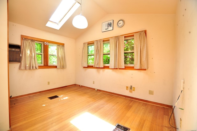14 River Rd, Cornwall, CT 06796 - unfurnished room with a skylight, wood finished floors, lofted ceiling, and a wall mounted AC