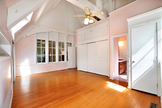 14 River Rd, Cornwall, CT 06796 - unfurnished bedroom featuring high vaulted ceiling, light wood finished floors, a closet, beam ceiling, and ceiling fan