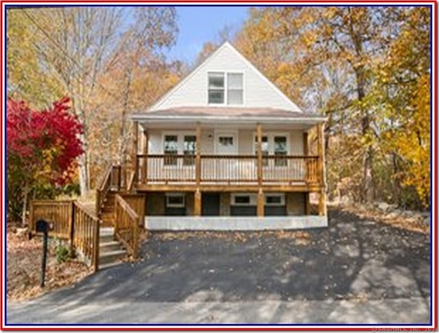 farmhouse featuring a porch