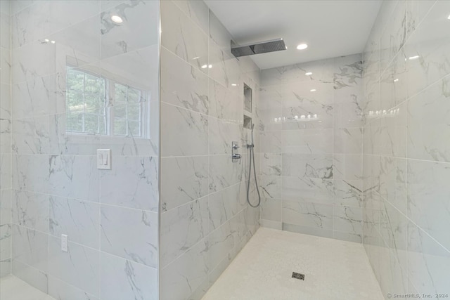 bathroom with a tile shower