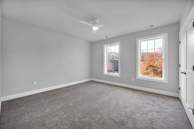 unfurnished room with ceiling fan and carpet floors