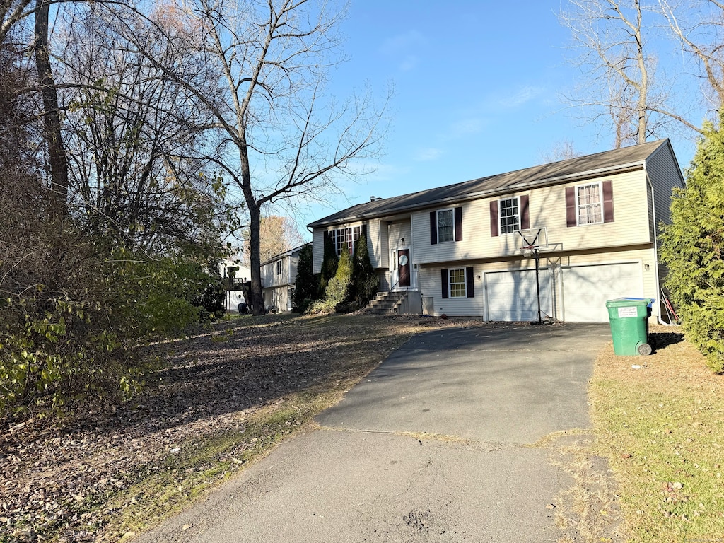 bi-level home featuring a garage