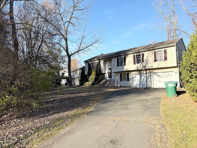 bi-level home featuring a garage