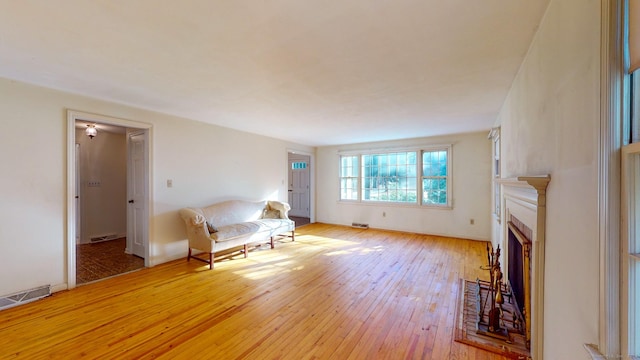 unfurnished room with light wood-type flooring