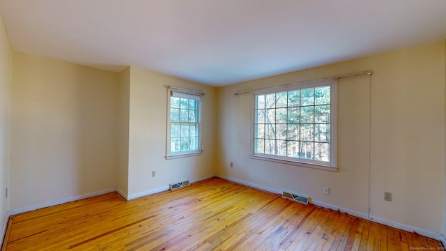 empty room featuring light hardwood / wood-style floors