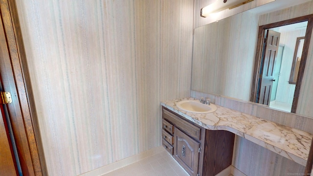 bathroom with tile patterned floors and vanity