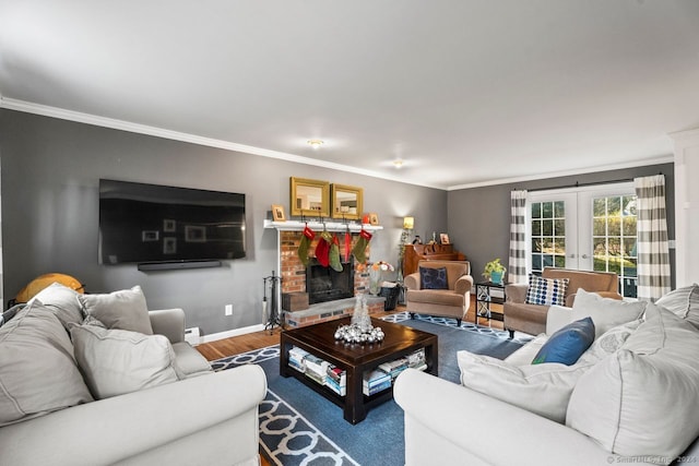 living room featuring french doors, hardwood / wood-style flooring, a brick fireplace, and ornamental molding