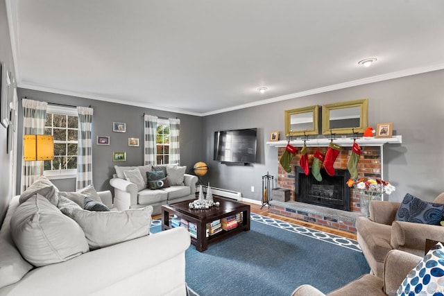 living room featuring hardwood / wood-style flooring, a fireplace, a baseboard heating unit, and ornamental molding