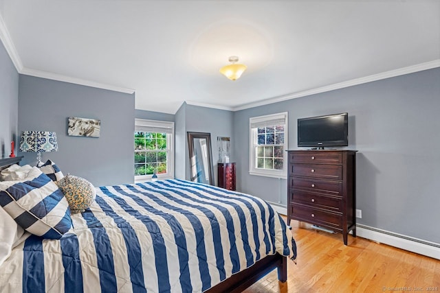 bedroom with light hardwood / wood-style flooring and ornamental molding