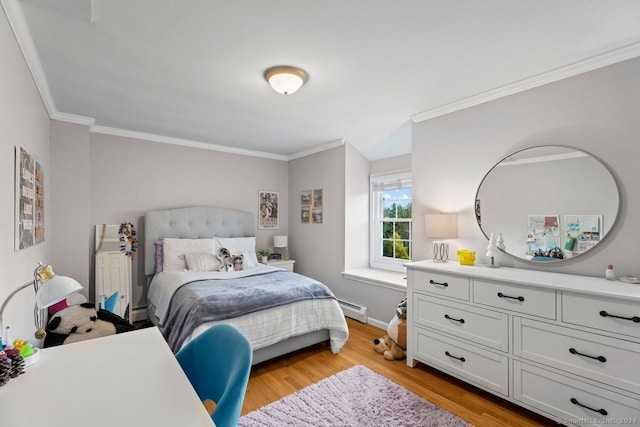 bedroom featuring ornamental molding, baseboard heating, and light hardwood / wood-style flooring