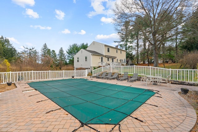 view of swimming pool with a patio