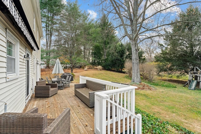 wooden terrace featuring a lawn and an outdoor living space