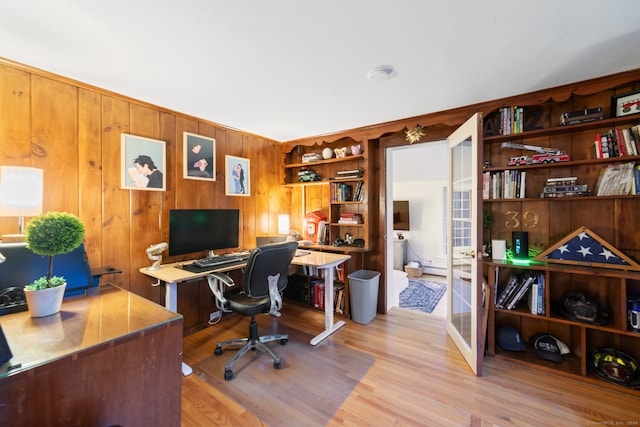 office featuring wood walls and light wood-type flooring