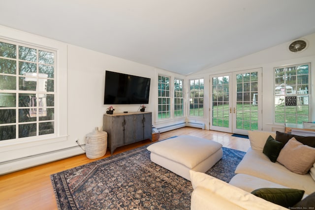 living room with french doors, a baseboard radiator, wood-type flooring, and lofted ceiling