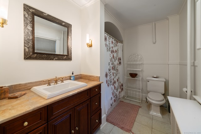 bathroom featuring crown molding, tile patterned flooring, vanity, and toilet